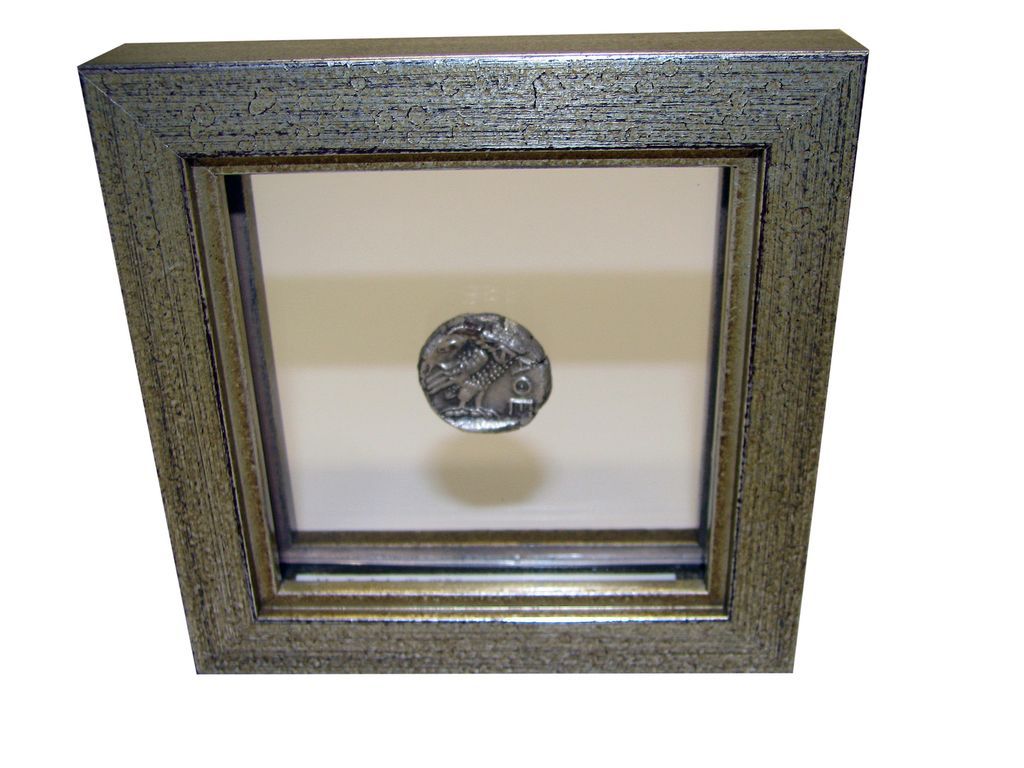 Greek coin in double sided frame