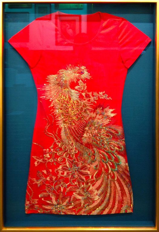 Fancy embroidered dress in shadow box frame