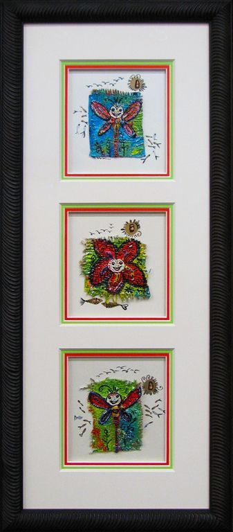 Three framed pictures of dragonflies and flowers in a black frame