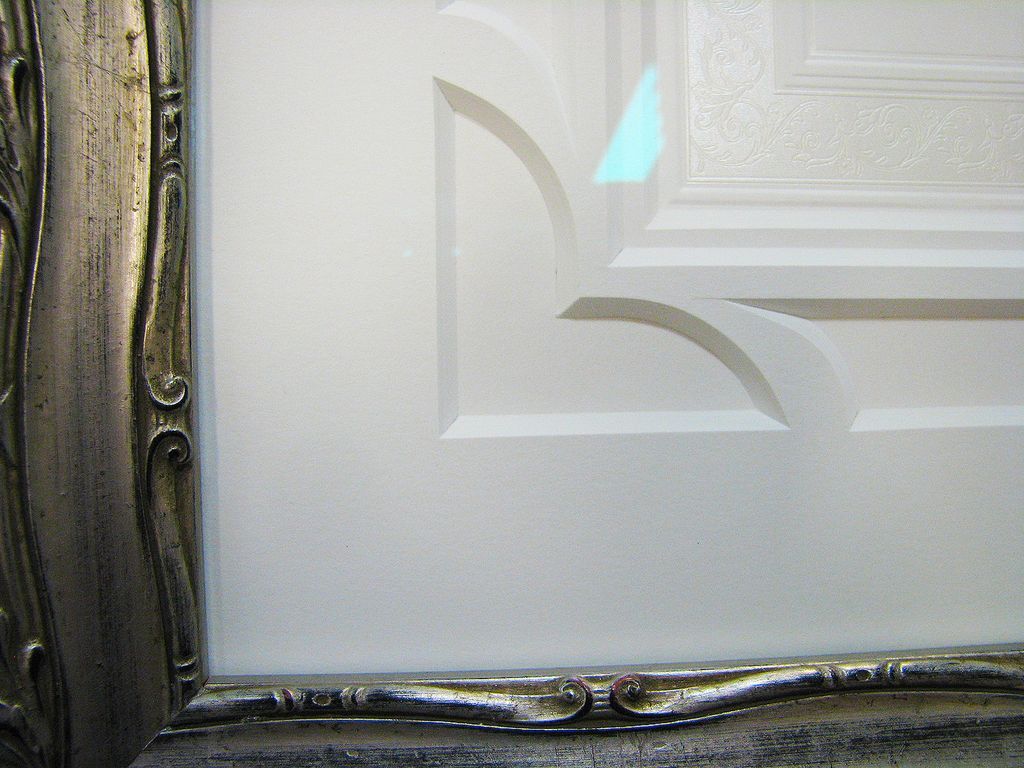 A picture of a door with a silver frame