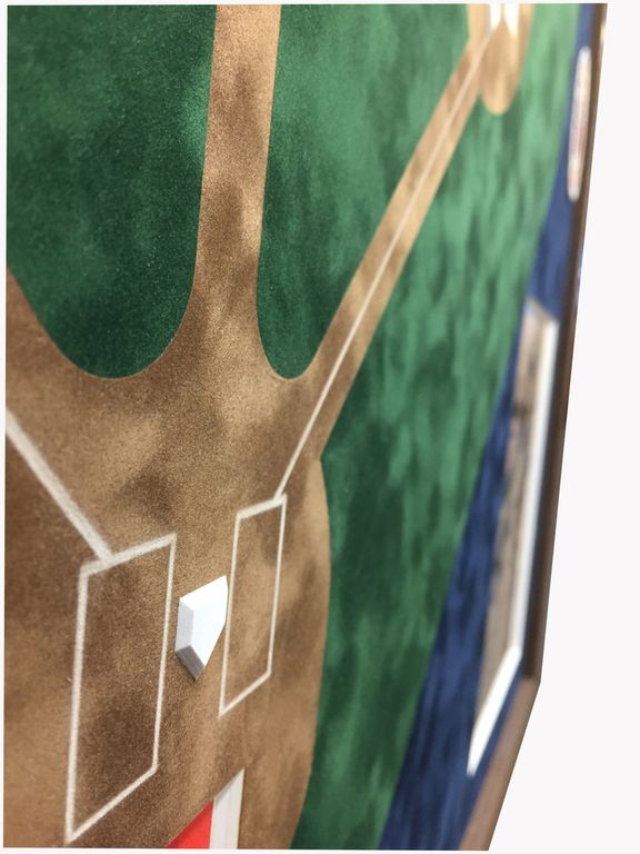 A close up of a baseball field with a base