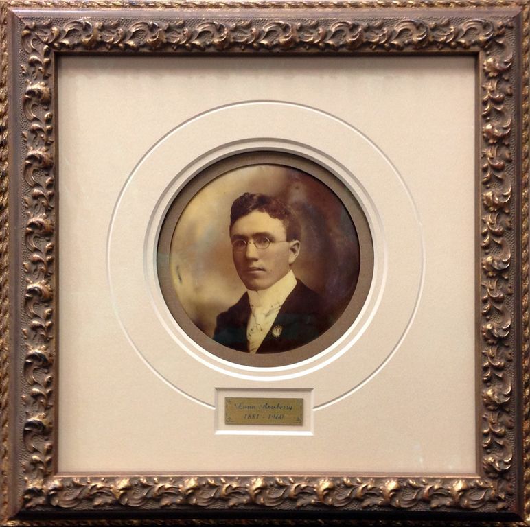 A framed picture of a man in a suit and tie