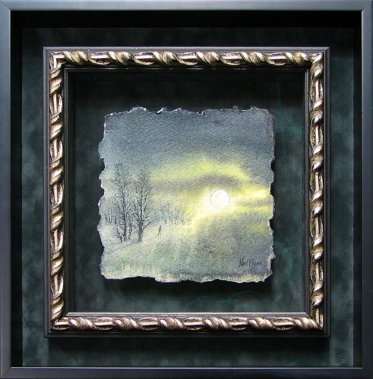 A framed picture of the sun shining through the clouds