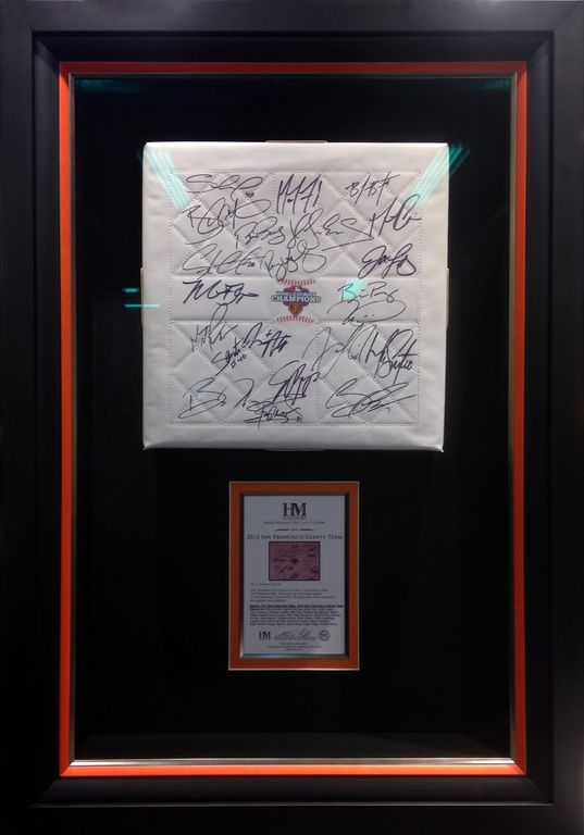 A framed piece of paper with signatures
