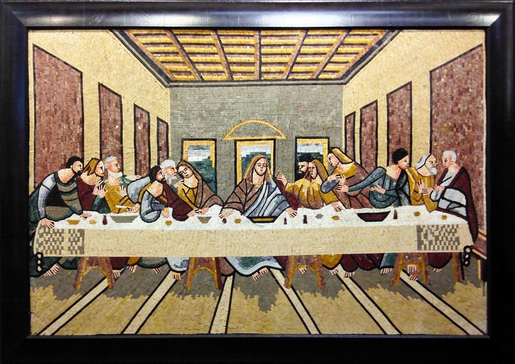 A painting of the last supper in a black frame