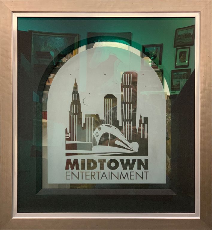 A picture in a frame that says Midtown Entertainment