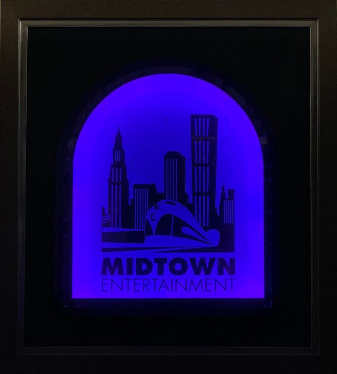 The logo for Midtown Entertainment is glowing in the dark