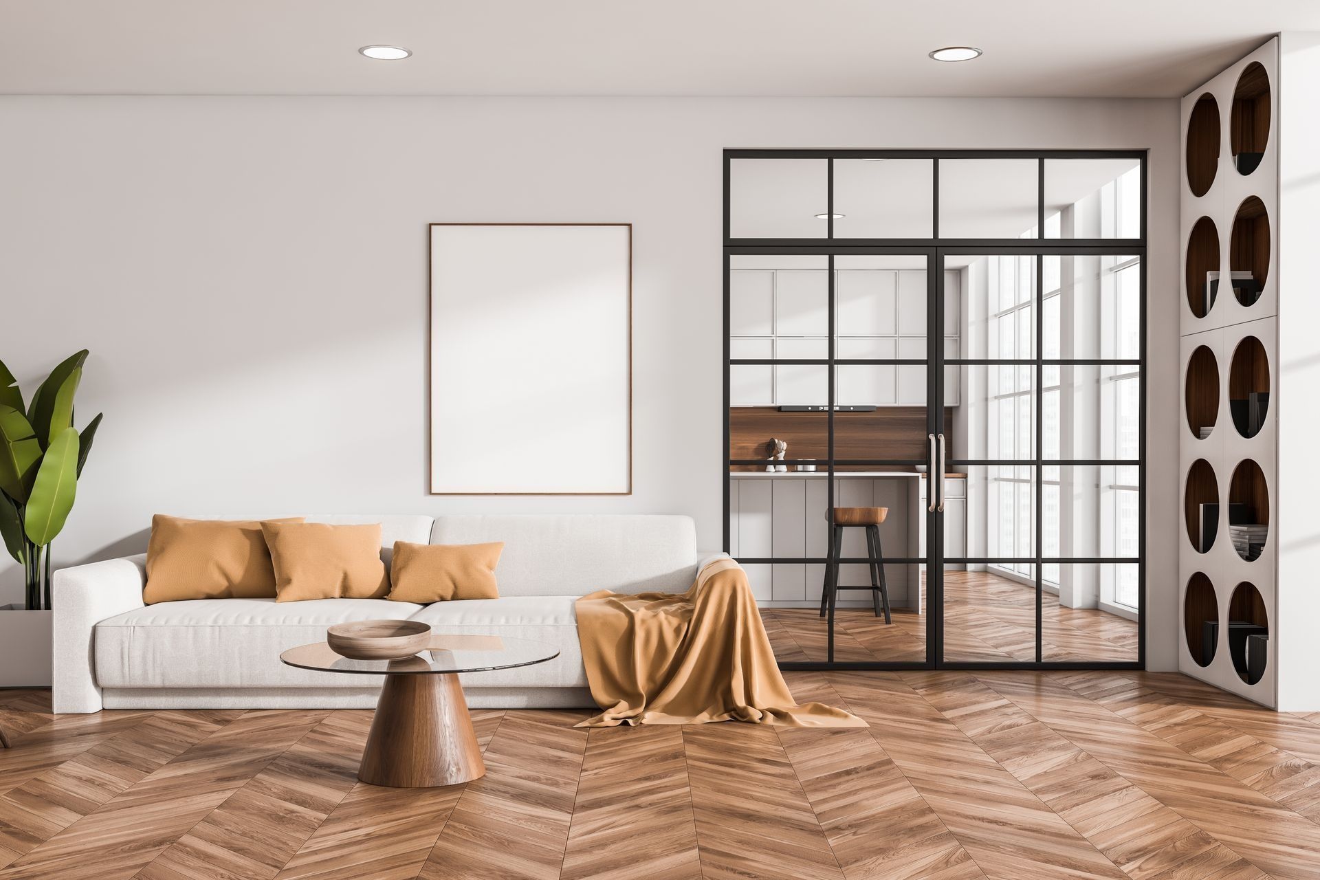 Living room with white sofa, brown table, and glass-paneled door, leading to a kitchen.