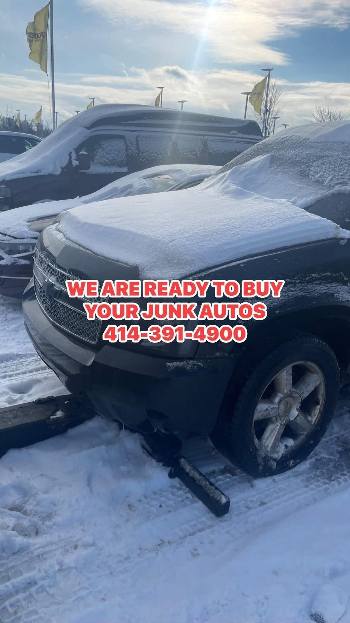 Snow-covered vehicles in a snowy setting. Text reads, We are ready to buy your junk autos. 414-391-4900.            