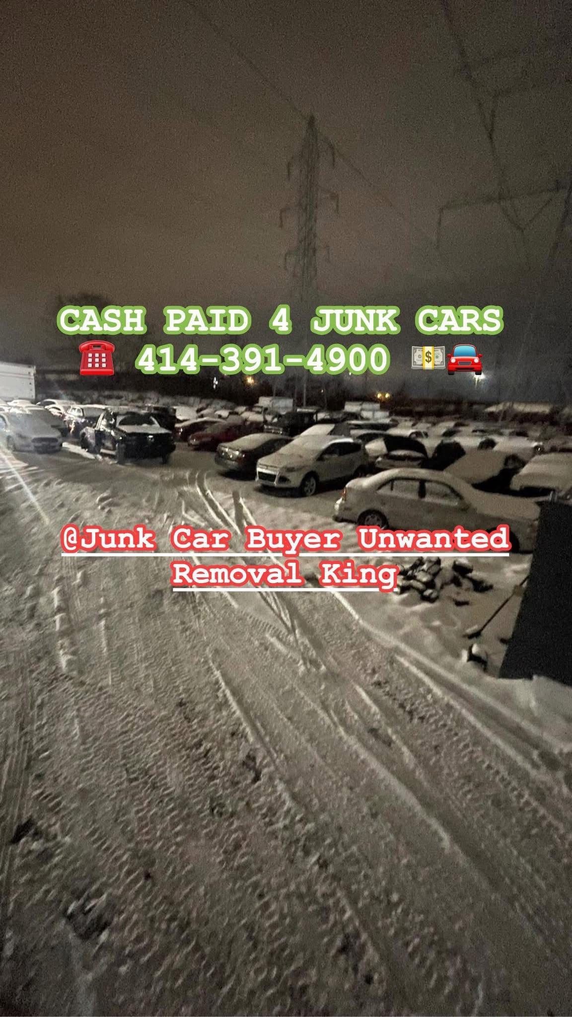 Snowy scene with junk cars, a business offering cash for them. 