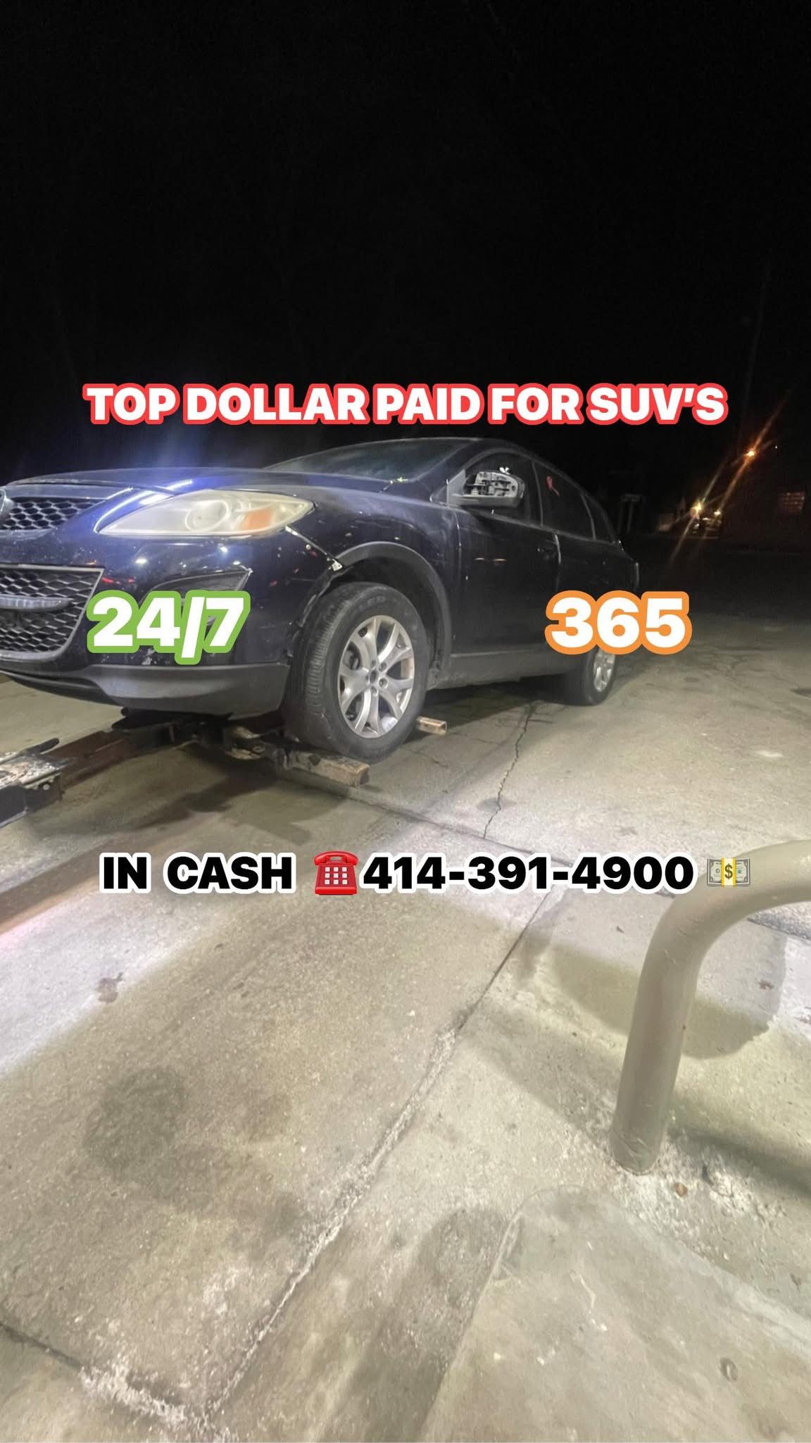 Black SUV at night, advertisement offering cash for SUVs 24/7/365, phone number visible. 