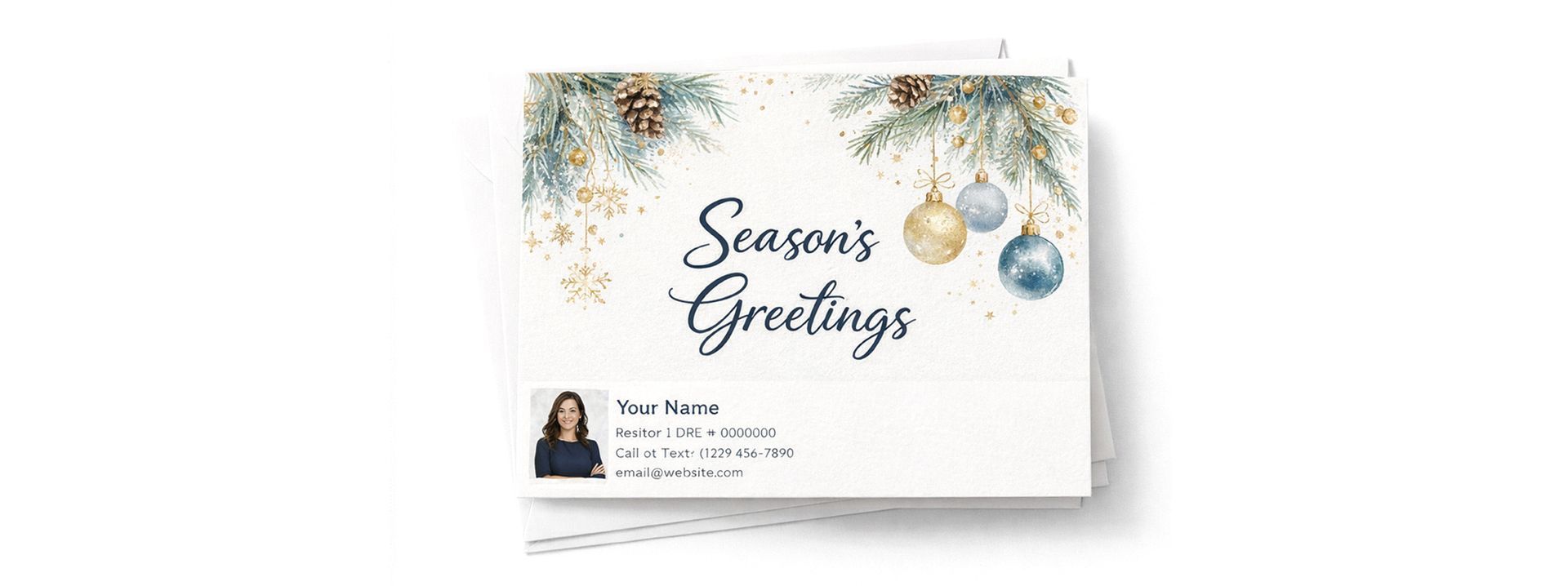 Holiday card with blue and gold ornaments, pine branches, and text reading 