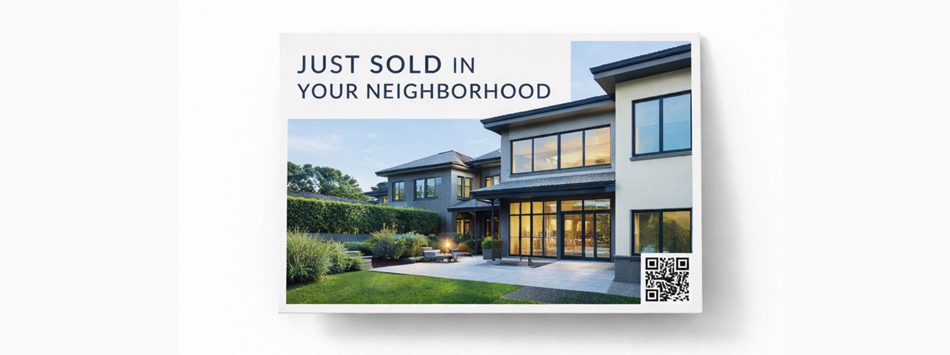 A real estate postcard showing a modern house with the text 