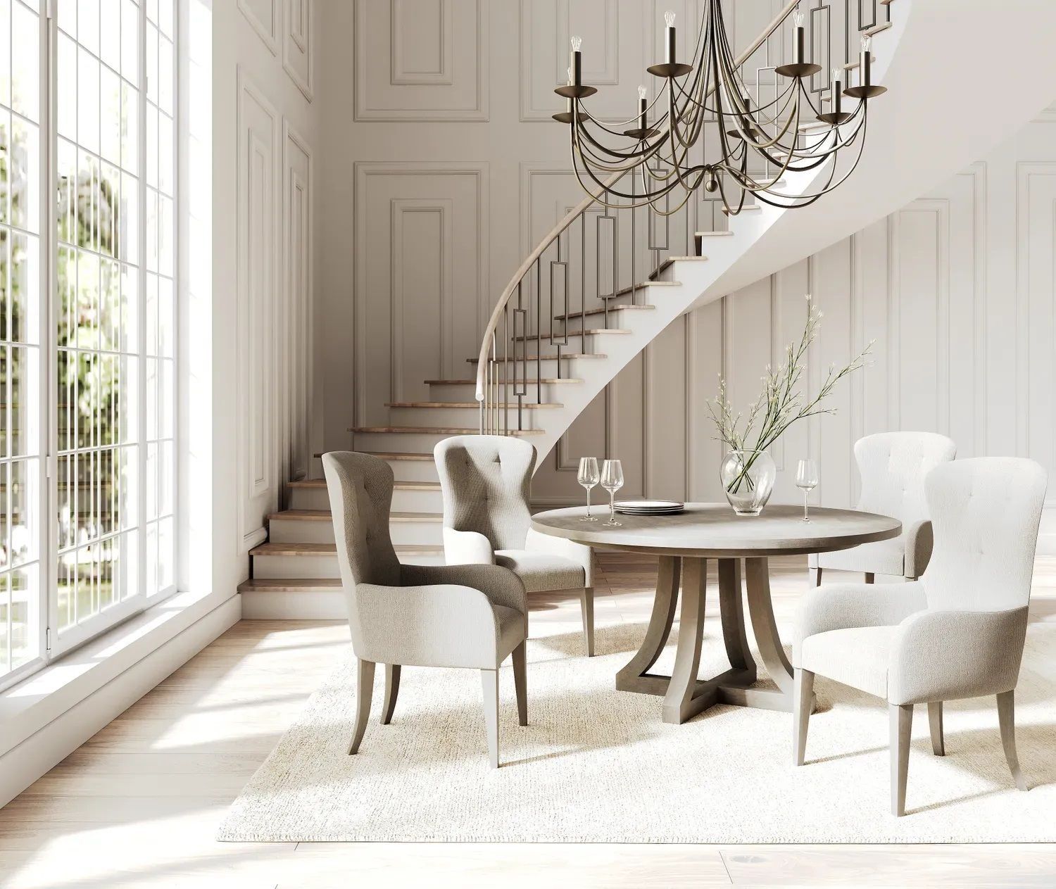A dining room with a table and chairs and a staircase.