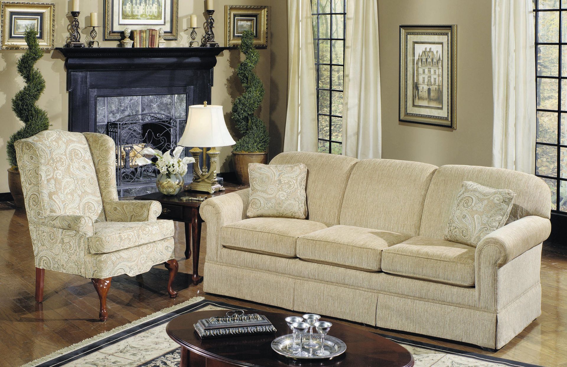 A living room with a couch a chair and a fireplace