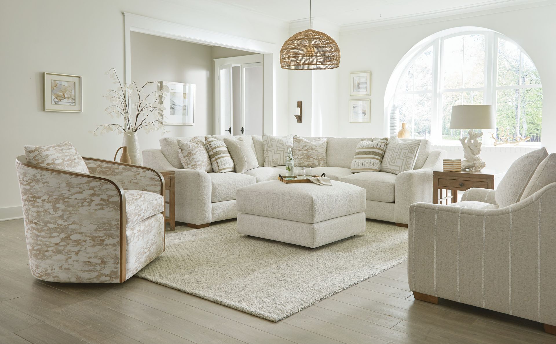 A living room filled with furniture and a rug.
