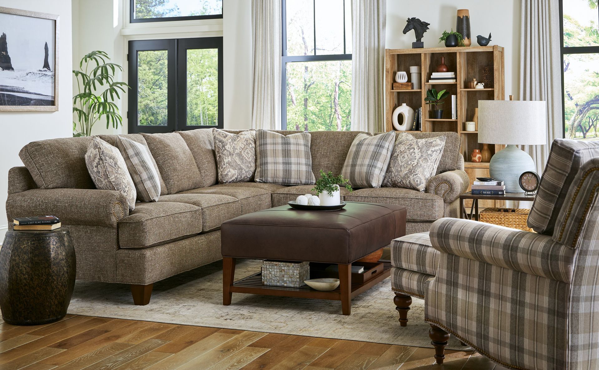 A living room filled with furniture and a large sectional couch.