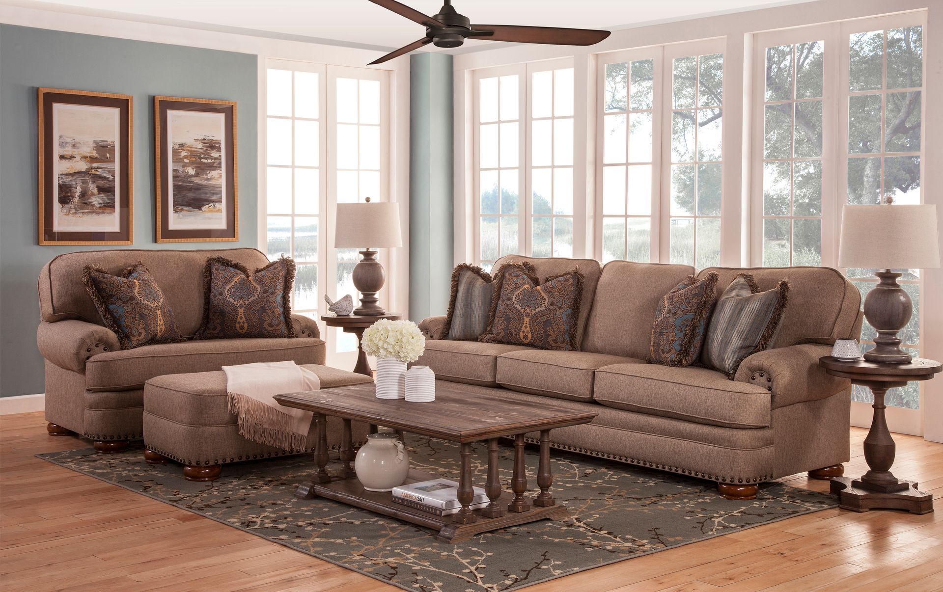 A living room filled with furniture and a ceiling fan.