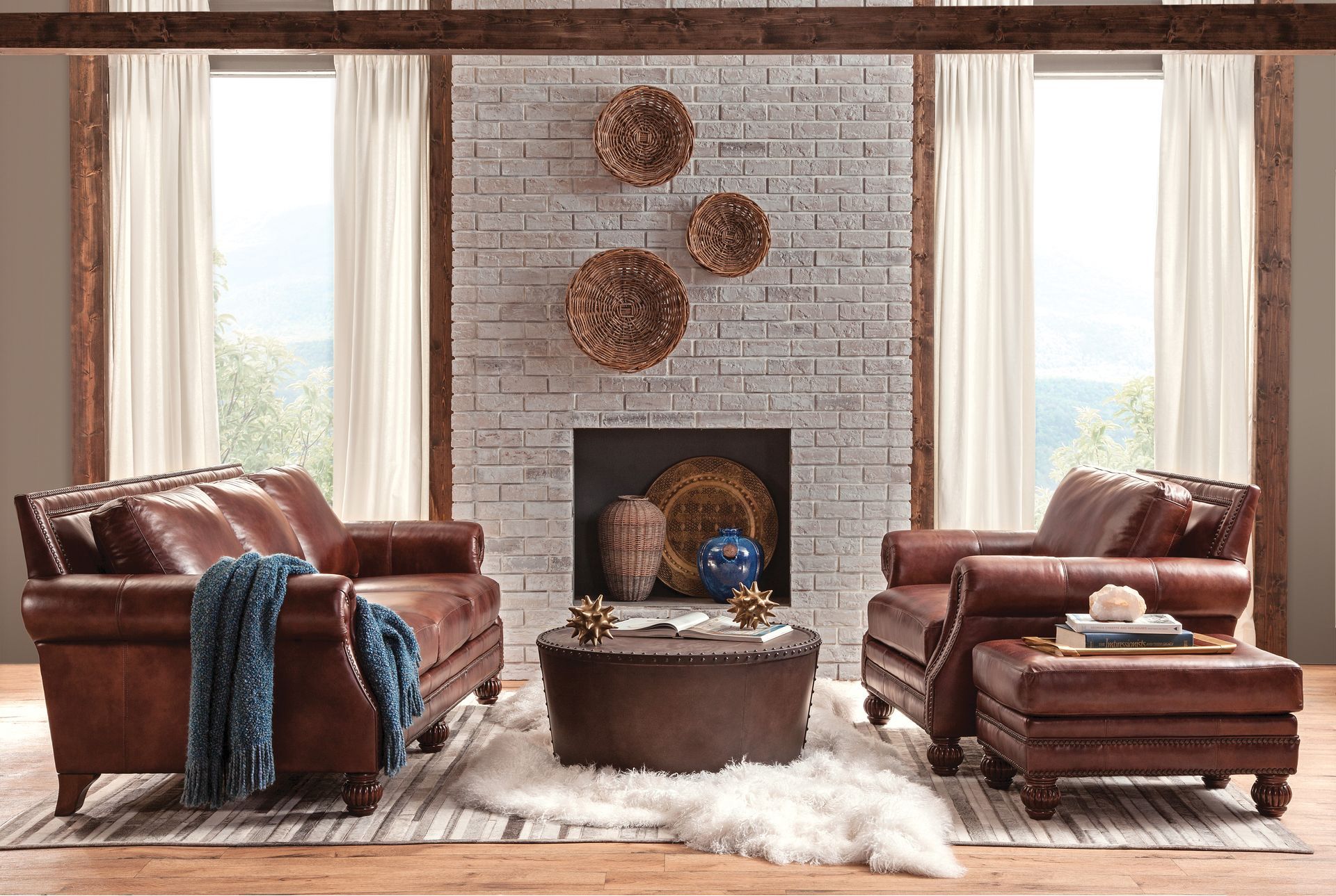 A living room filled with furniture and a fireplace.