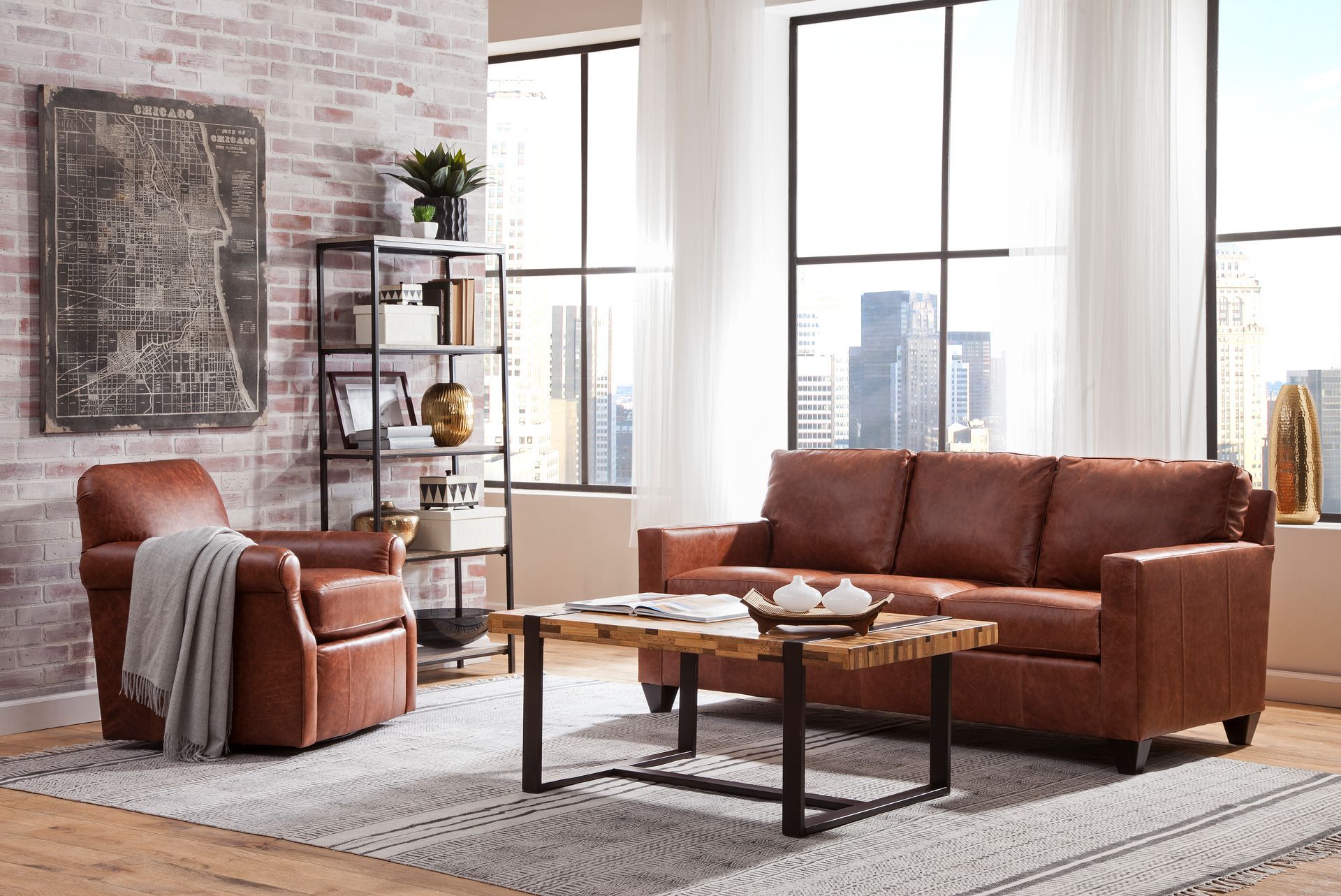 A living room with a brown leather couch , chair and coffee table.