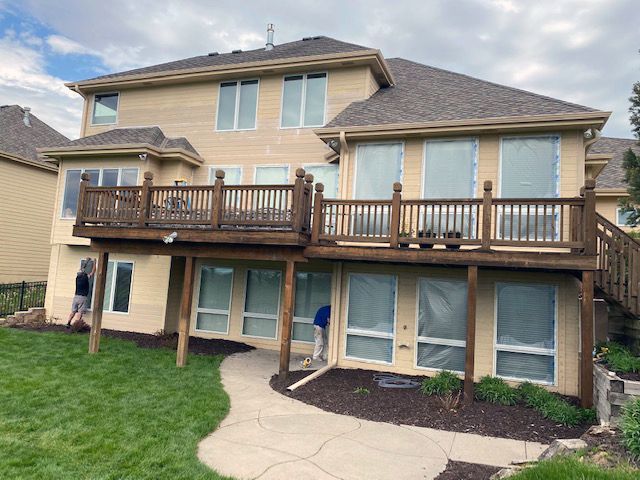 Painting home siding in Omaha