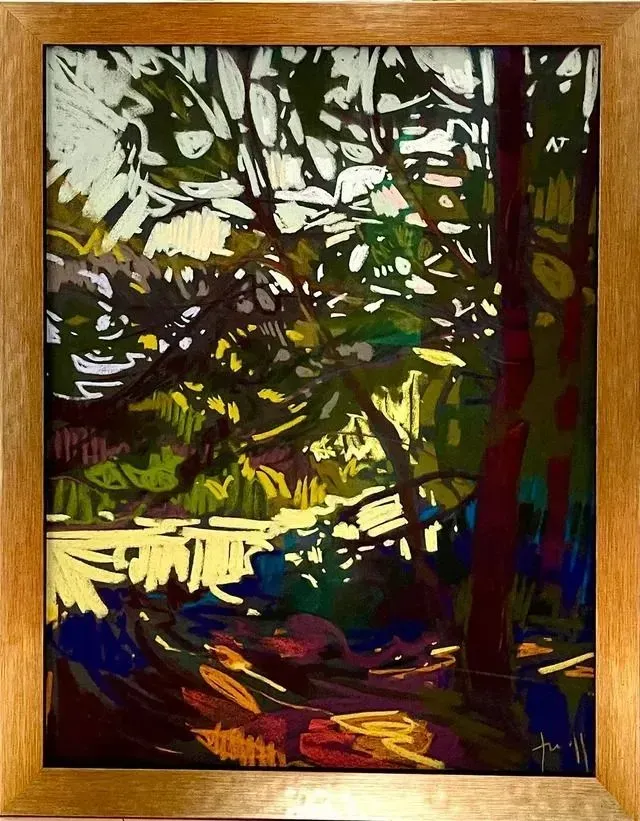 Abstract forest scene with bright green foliage, dark tree trunks, and a winding sunlit path.