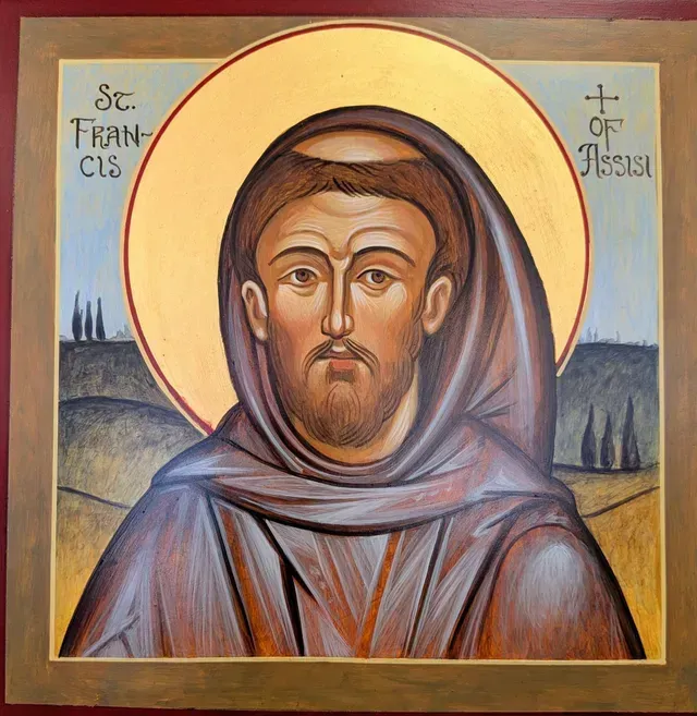 Byzantine-style icon of St. Francis, hooded in brown with a gold halo and calm expression.