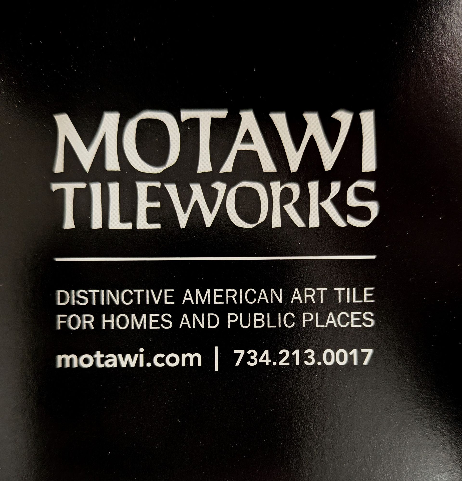 Motawi Tileworks logo and contact info on a dark background.
