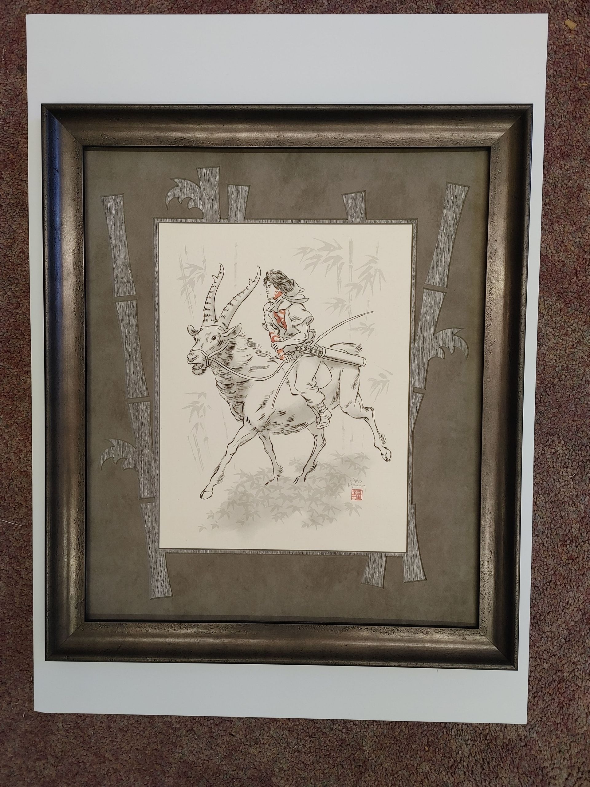 Framed abstract artwork with a rough sketch on a white center panel and textured gray background.