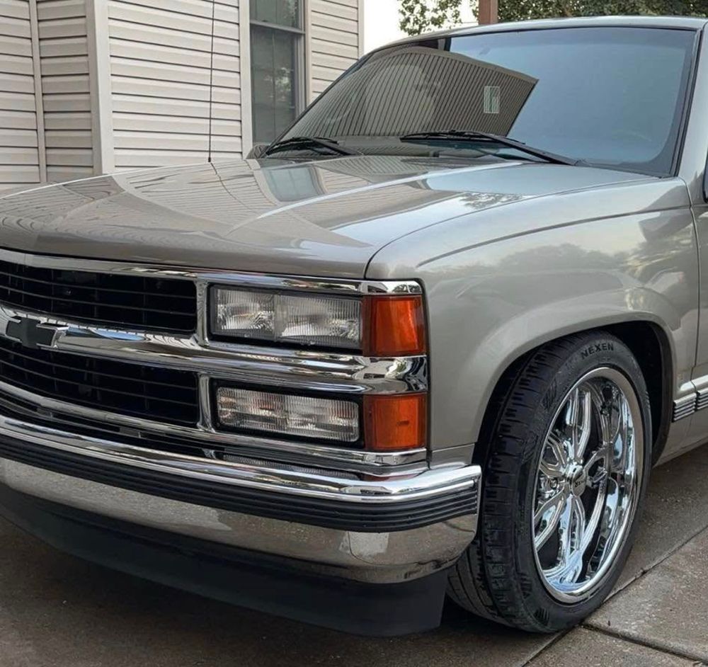 Silver Chevy pickup truck with chrome accents and custom rims - after.