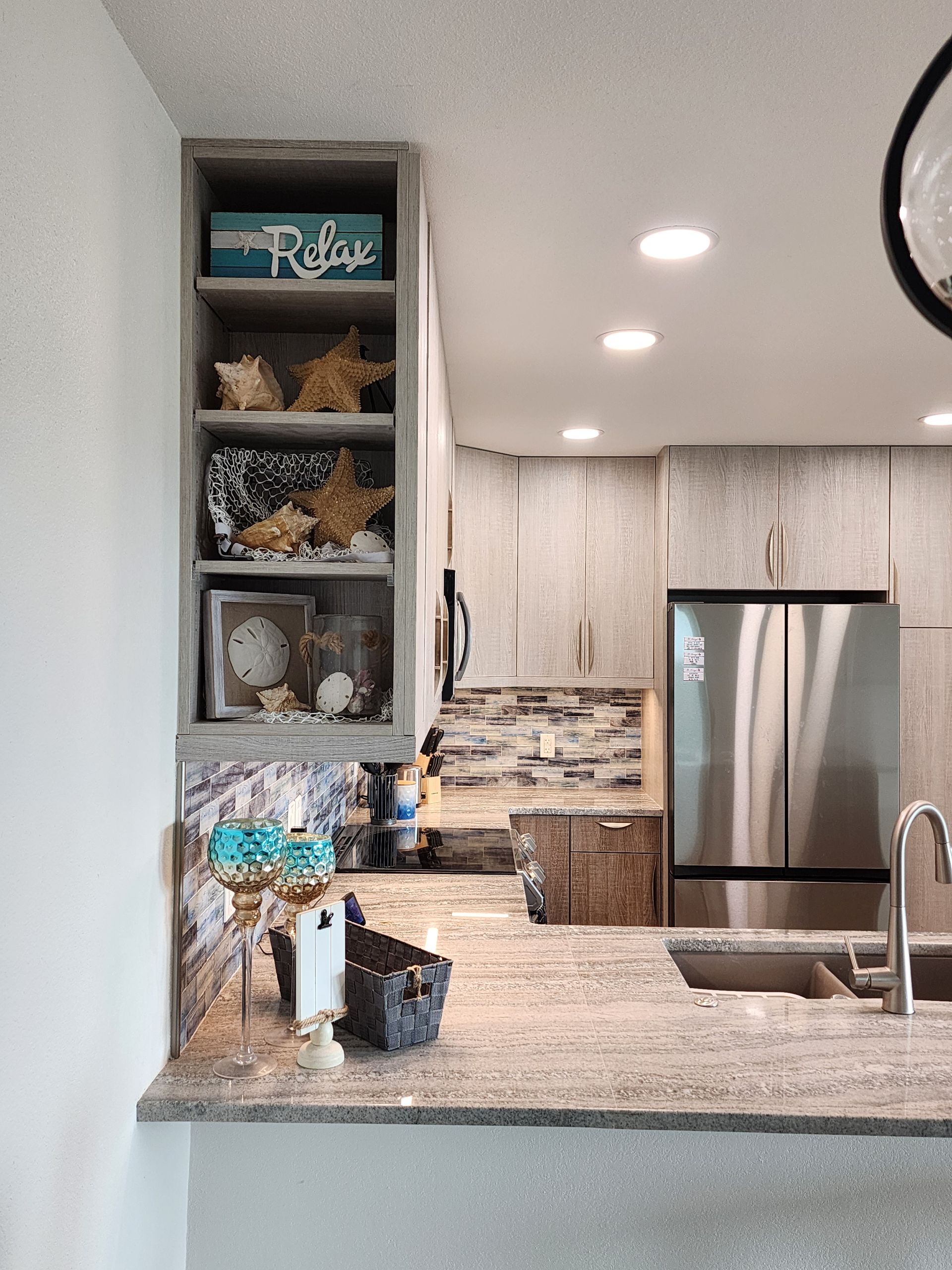 A kitchen with stainless steel appliances and granite counter tops