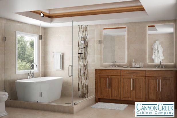A bathroom with canyon creek cabinet company written on the bottom