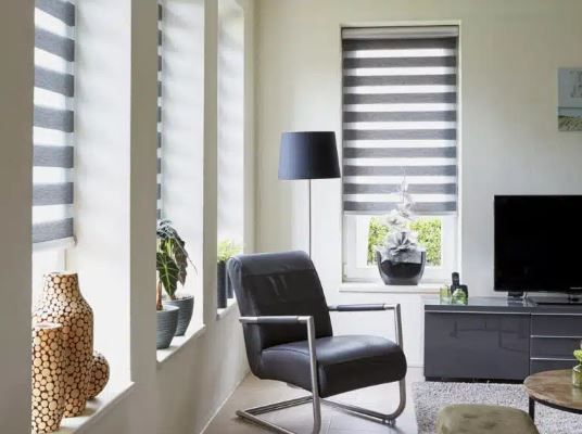 A living room with a chair and a television