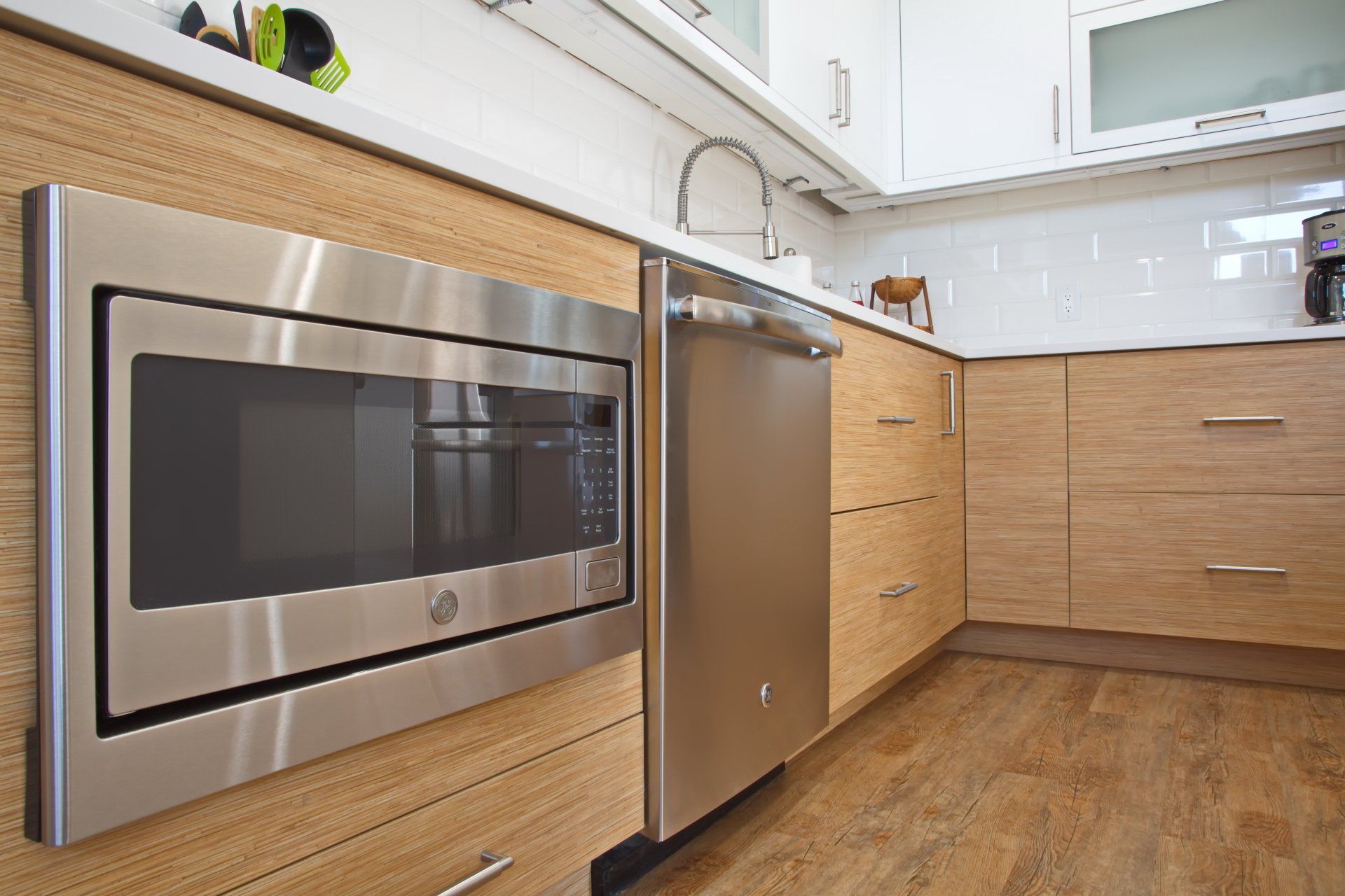 A kitchen with stainless steel appliances and wooden cabinets