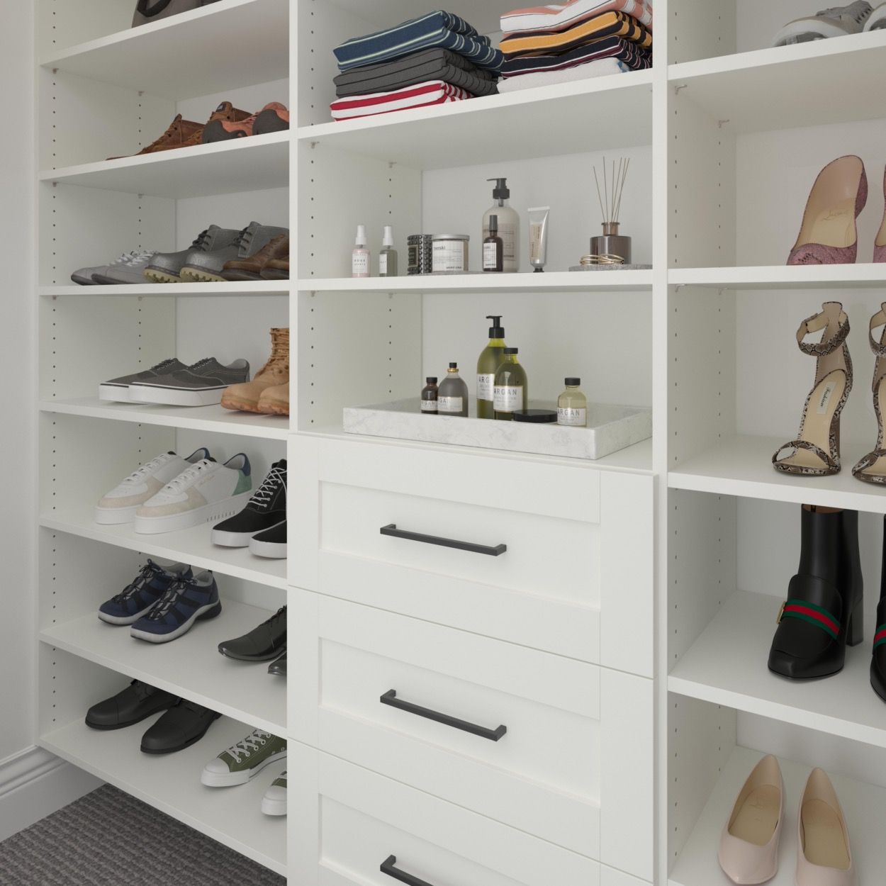 A walk in closet with wooden cabinets and drawers