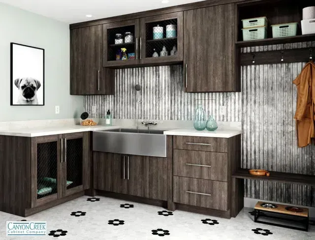 A kitchen with a sink and a picture of a dog on the wall