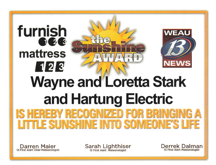 The Sunshine Award provided by WEAU 13 News for Wayne and Loretta Stark at Hartung Electric