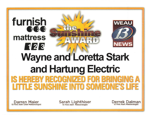 The Sunshine Award provided by WEAU 13 News for Wayne and Loretta Stark at Hartung Electric