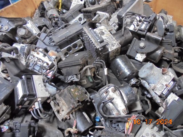 Heap of assorted automotive parts