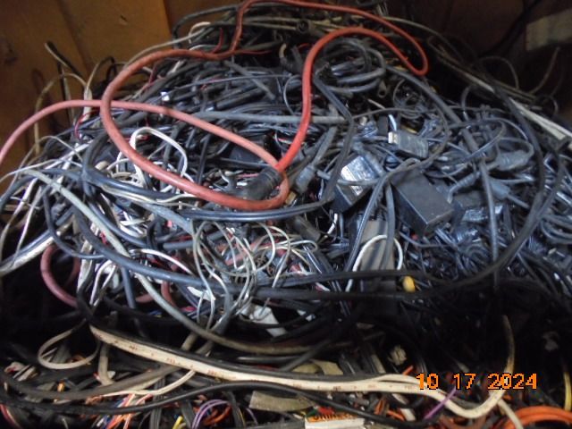 Tangled pile of assorted electronic cables