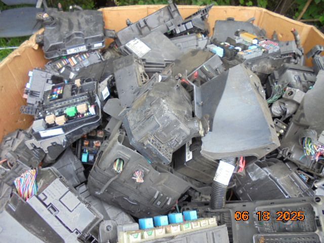 Automotive fuse boxes in a cardboard box