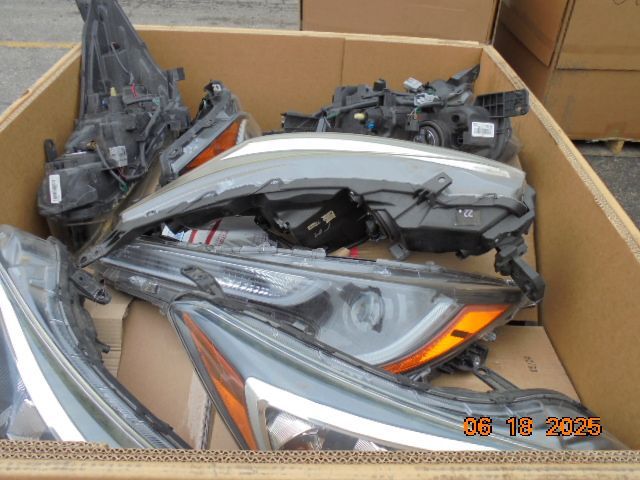 Cardboard box with various car headlights