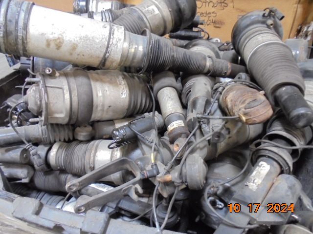 Pile of used car air suspension struts and shocks