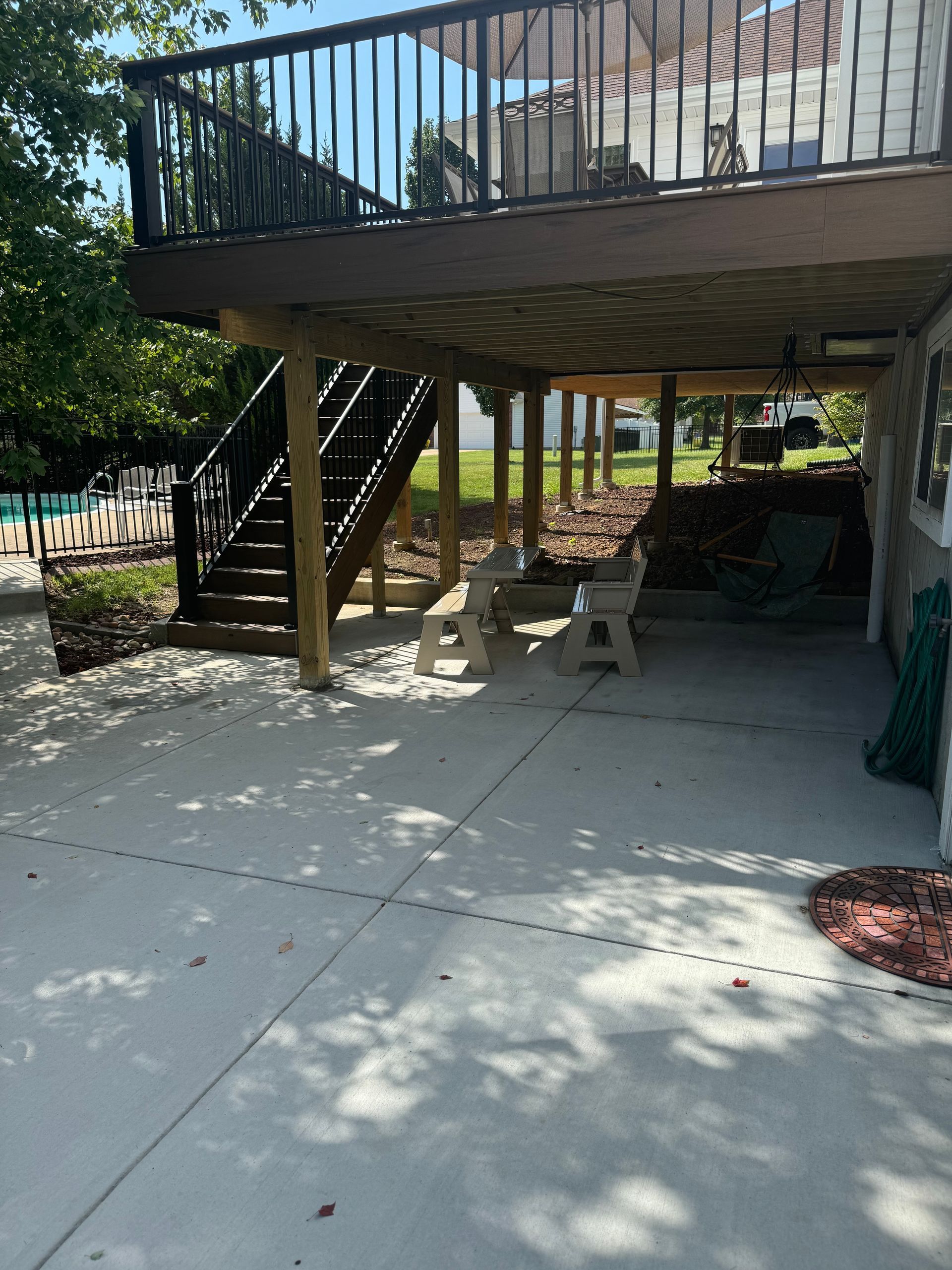 A large deck with stairs leading up to it