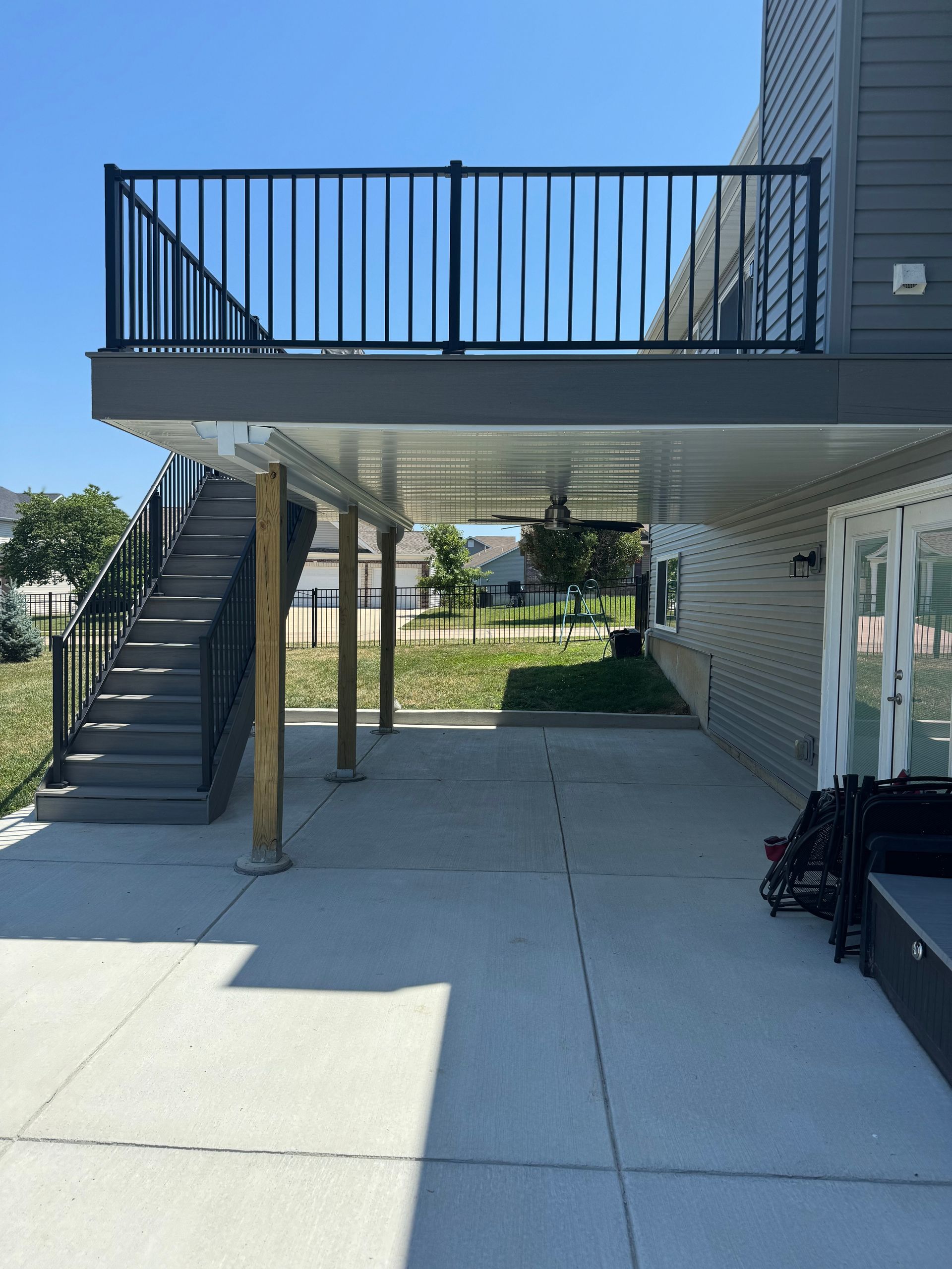 A large deck with stairs leading up to it