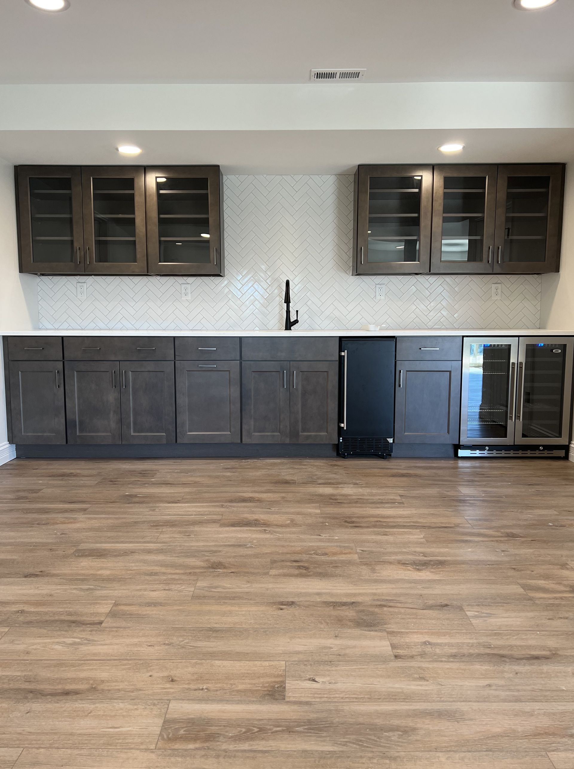A kitchen with wooden cabinets and stainless steel appliances