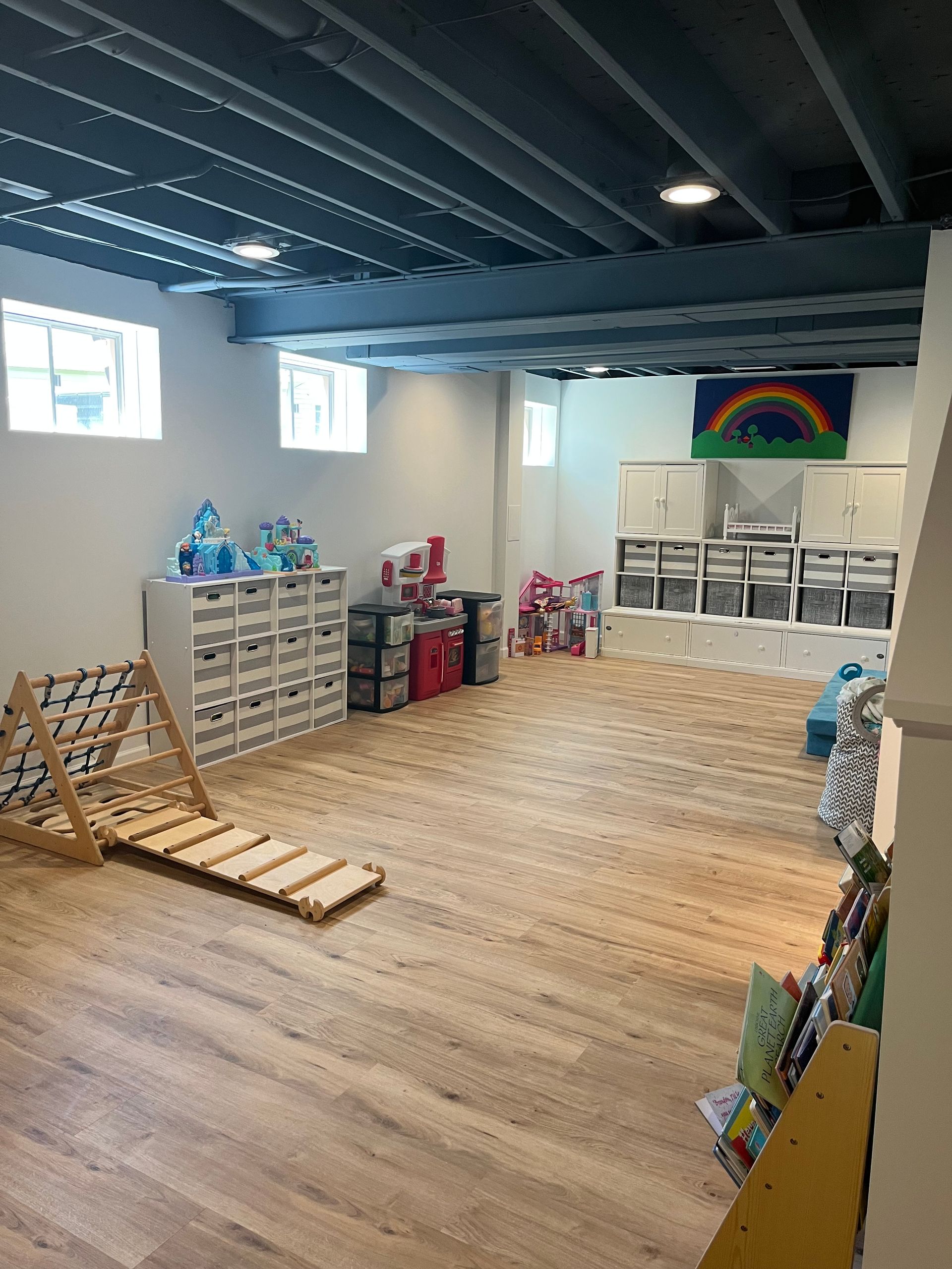 A basement room with wooden floors