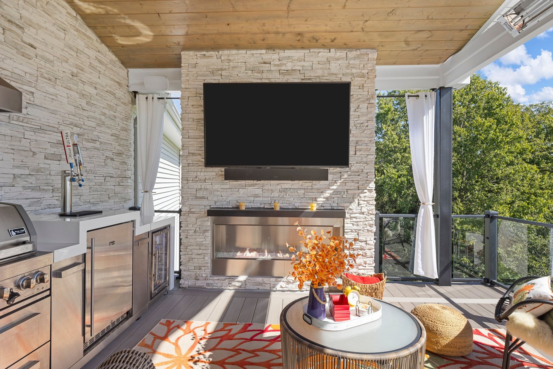 A fireplace room with a flat screen tv on the wall