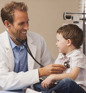 Doctor examining a child