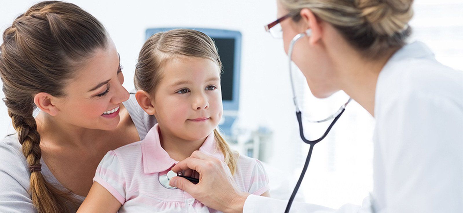 Young girl with mother and doctor